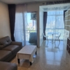 1-bedroom, 2-bath condo at Nusasiri Grand, 80 sqm, steps from BTS Ekkamai. Rent for 35,000 THB/month. Prime location, luxury living.