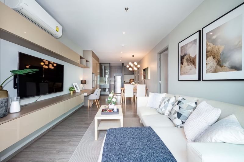 Rent a luxurious 2-bedroom 2-bathroom condo at Rhythm Ekkamai. Stunning 21st-floor views, 80 sqm, fully furnished, near BTS Ekkamai. Rent: 75,000 THB/month.