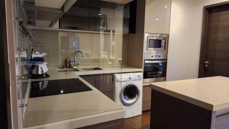 Modern 2-bedrooms, 2-bathrooms condo at Ivy Ampio, 82 sqm, near MRT Cultural Center. Rent 60K/month or Sale 17M. Fully furnished, east-facing views.