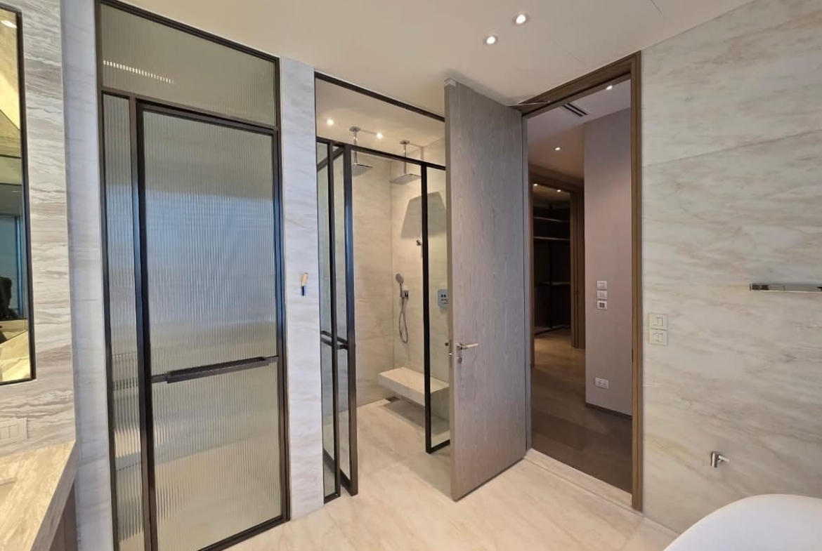 Luxury 3-bed, 3-bath condo at Scope Langsuan, 241 sqm, for rent at 480,000 THB/month. Prime location near BTS Ploenchit, with top-tier amenities and security.
