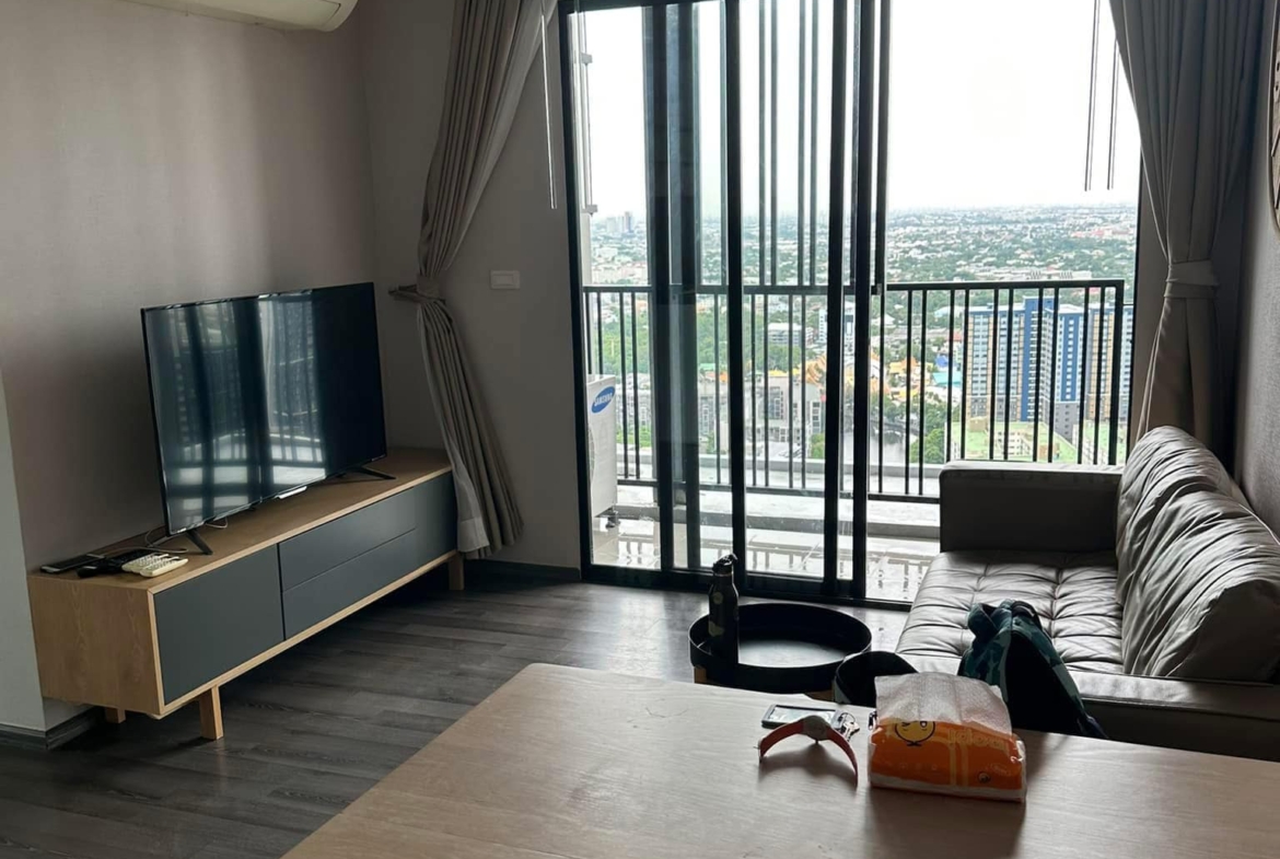 Modern 2-BR Condo at The Base Park West Sukhumvit 77, 44.61 sqm, high floor, rent 27,000 THB/month or buy for 7.29M THB. Stunning views, near BTS.