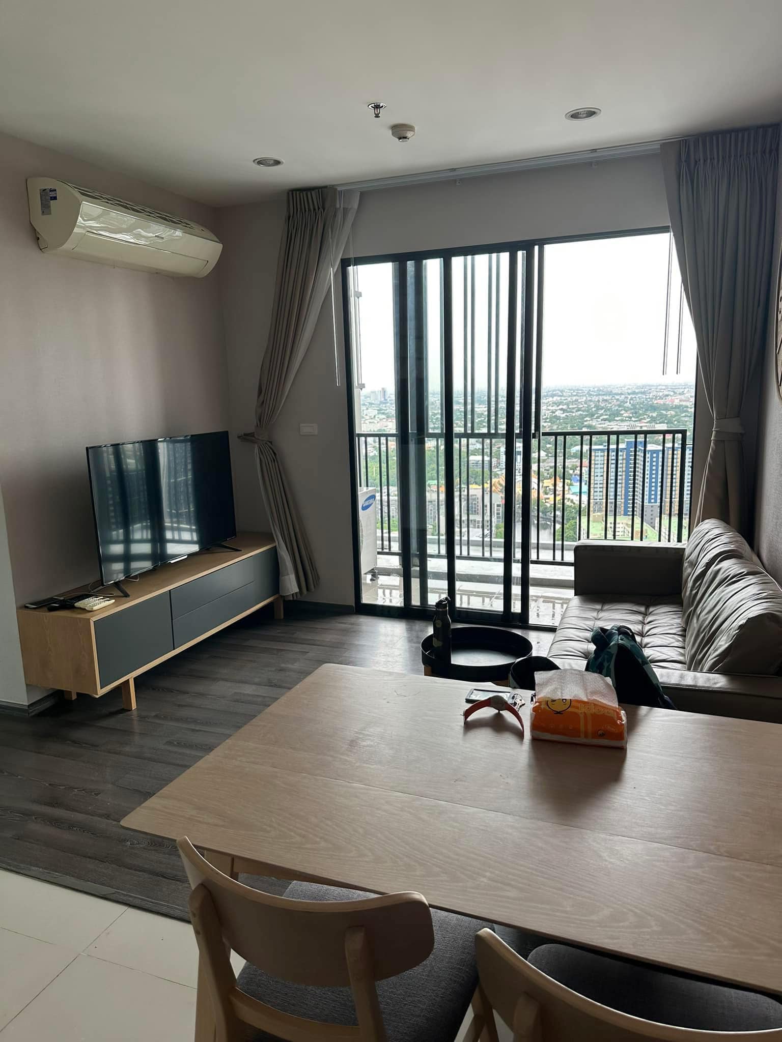 Modern 2-BR Condo at The Base Park West Sukhumvit 77, 44.61 sqm, high floor, rent 27,000 THB/month or buy for 7.29M THB. Stunning views, near BTS.