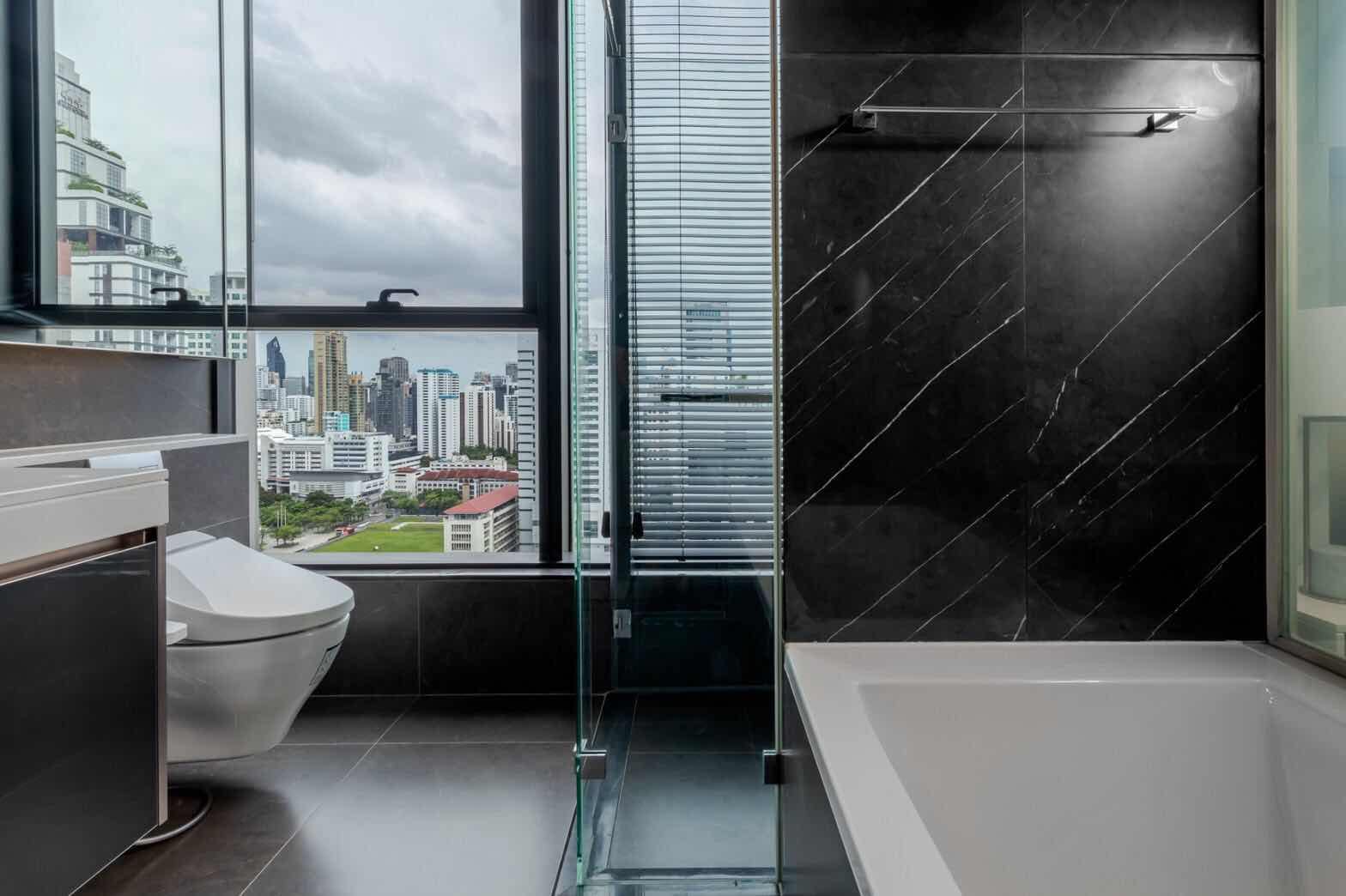 Luxury 2-Bedroom, 2-Bathroom, 77 sqm condo at The Esse at Singha Complex for rent ฿75,000/month. High floor, skyline view, fully furnished, MRT Phetchaburi.