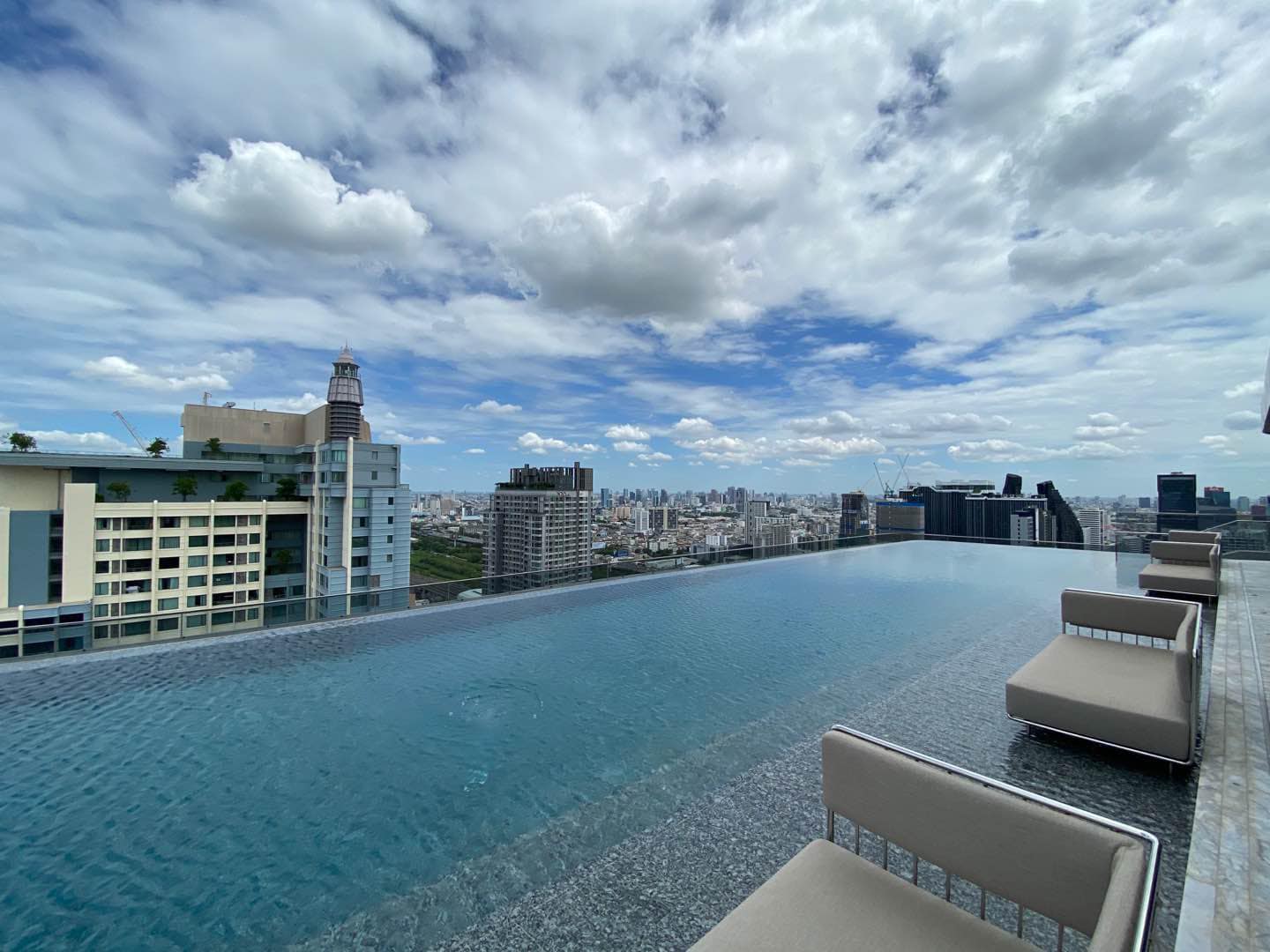 Luxury 2-Bedroom, 2-Bathroom, 77 sqm condo at The Esse at Singha Complex for rent ฿75,000/month. High floor, skyline view, fully furnished, MRT Phetchaburi.