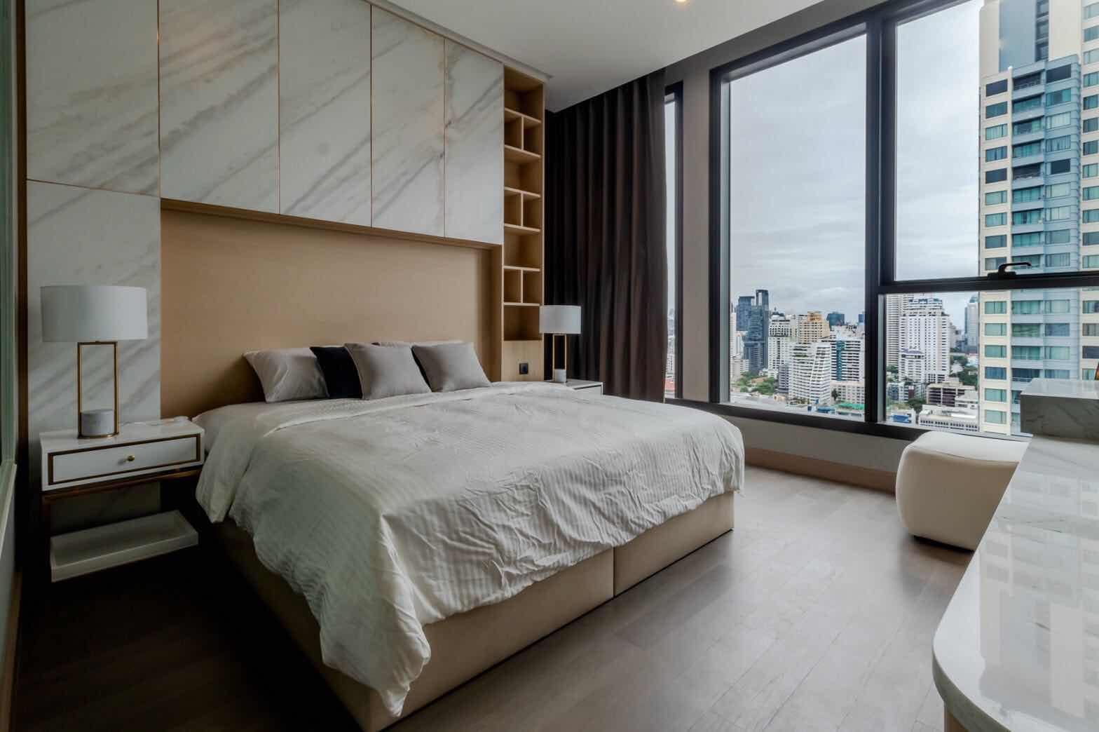 Luxury 2-Bedroom, 2-Bathroom, 77 sqm condo at The Esse at Singha Complex for rent ฿75,000/month. High floor, skyline view, fully furnished, MRT Phetchaburi.
