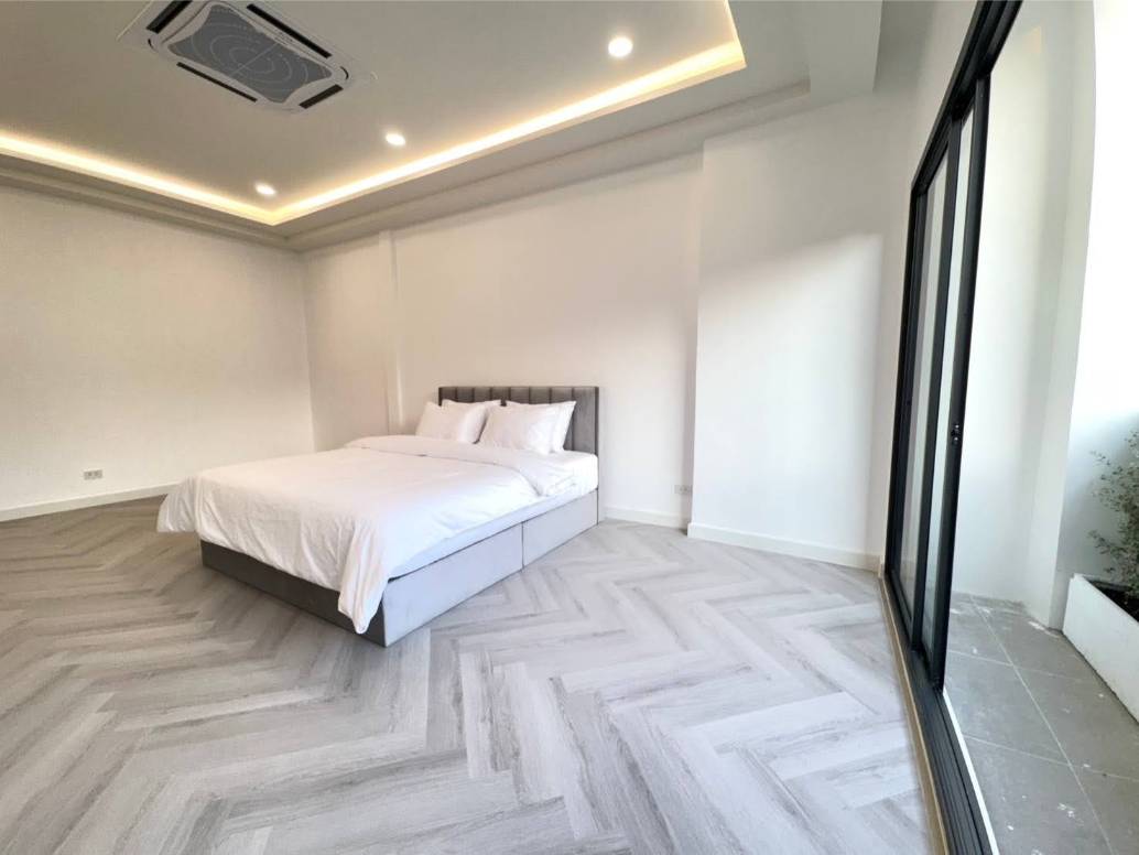 Rent this spacious 4-bedroom, 4-bathroom townhouse in Pridi Panomyong 42. 250 sqm with modern design and private garden. Available for 110,000 THB/month