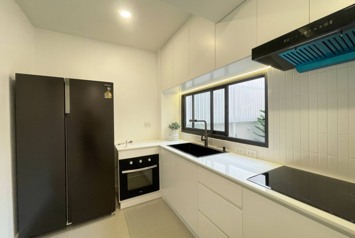 Rent this spacious 4-bedroom, 4-bathroom townhouse in Pridi Panomyong 42. 250 sqm with modern design and private garden. Available for 110,000 THB/month