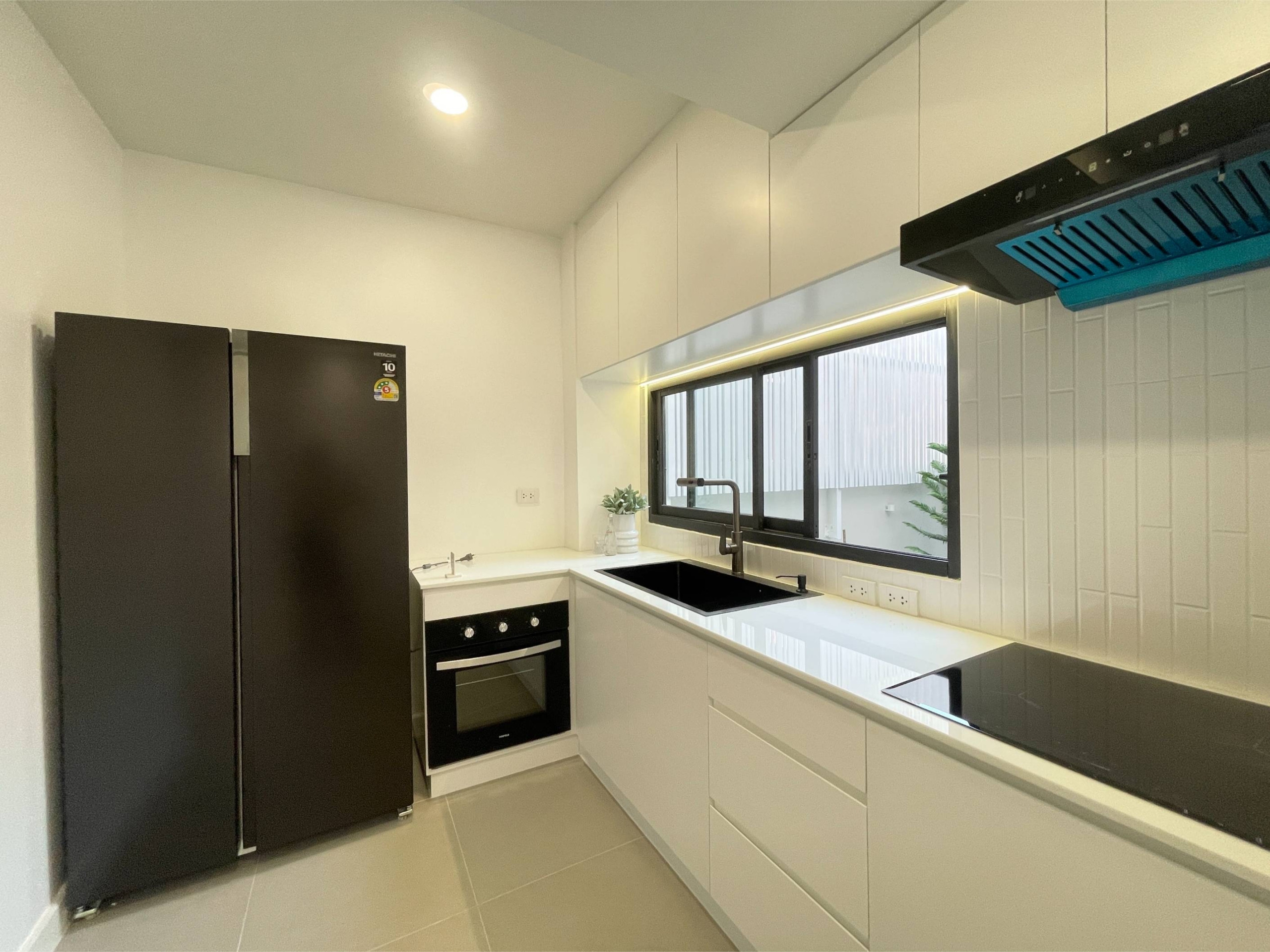 Rent this spacious 4-bedroom, 4-bathroom townhouse in Pridi Panomyong 42. 250 sqm with modern design and private garden. Available for 110,000 THB/month
