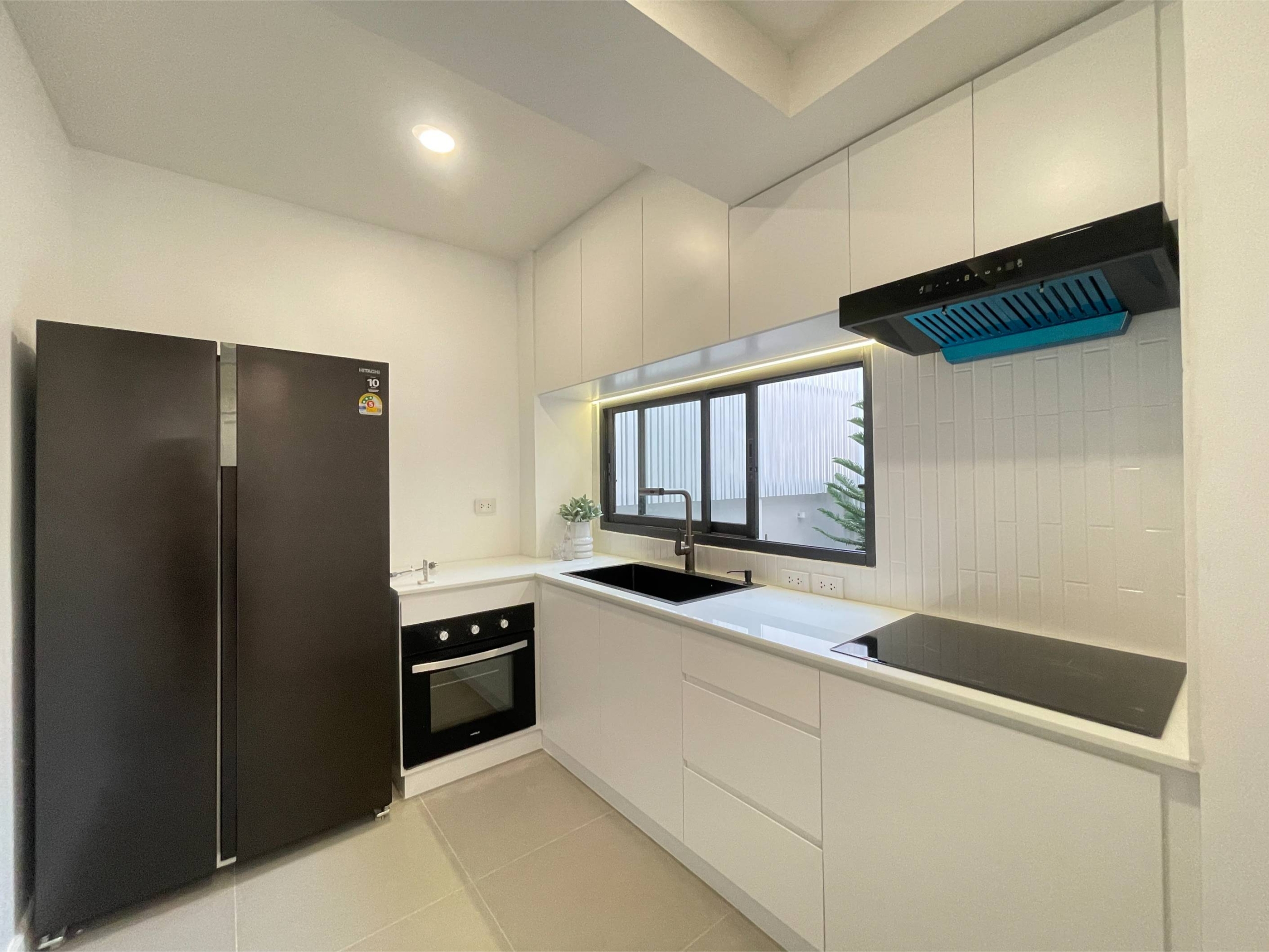 Rent this spacious 4-bedroom, 4-bathroom townhouse in Pridi Panomyong 42. 250 sqm with modern design and private garden. Available for 110,000 THB/month