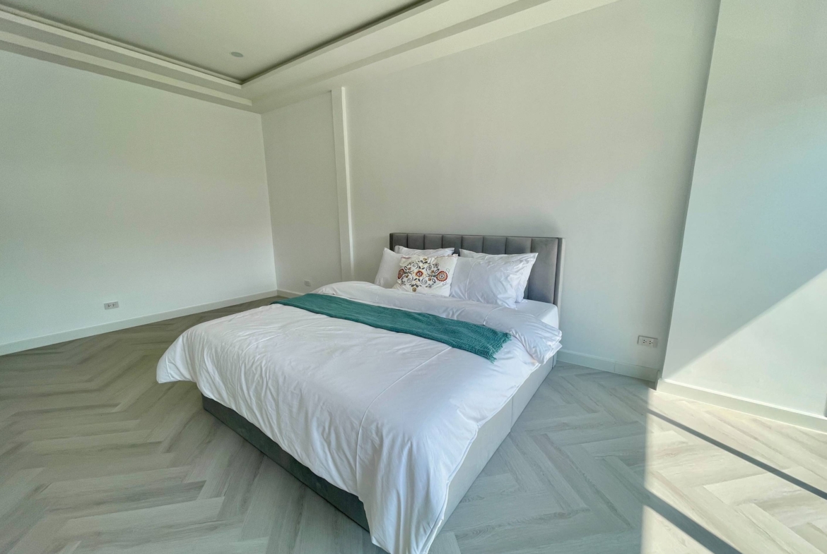 Rent this spacious 4-bedroom, 4-bathroom townhouse in Pridi Panomyong 42. 250 sqm with modern design and private garden. Available for 110,000 THB/month