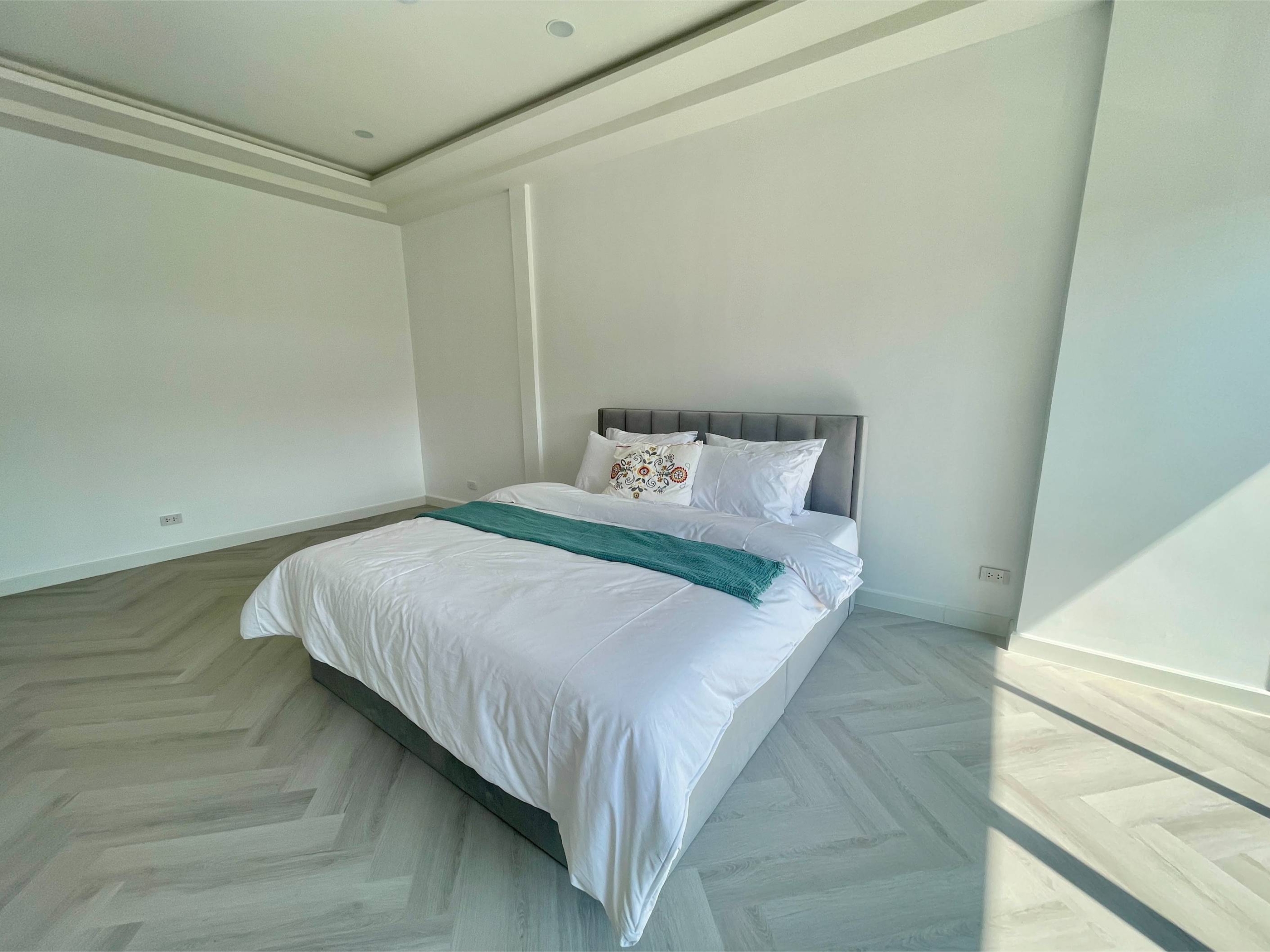 Rent this spacious 4-bedroom, 4-bathroom townhouse in Pridi Panomyong 42. 250 sqm with modern design and private garden. Available for 110,000 THB/month