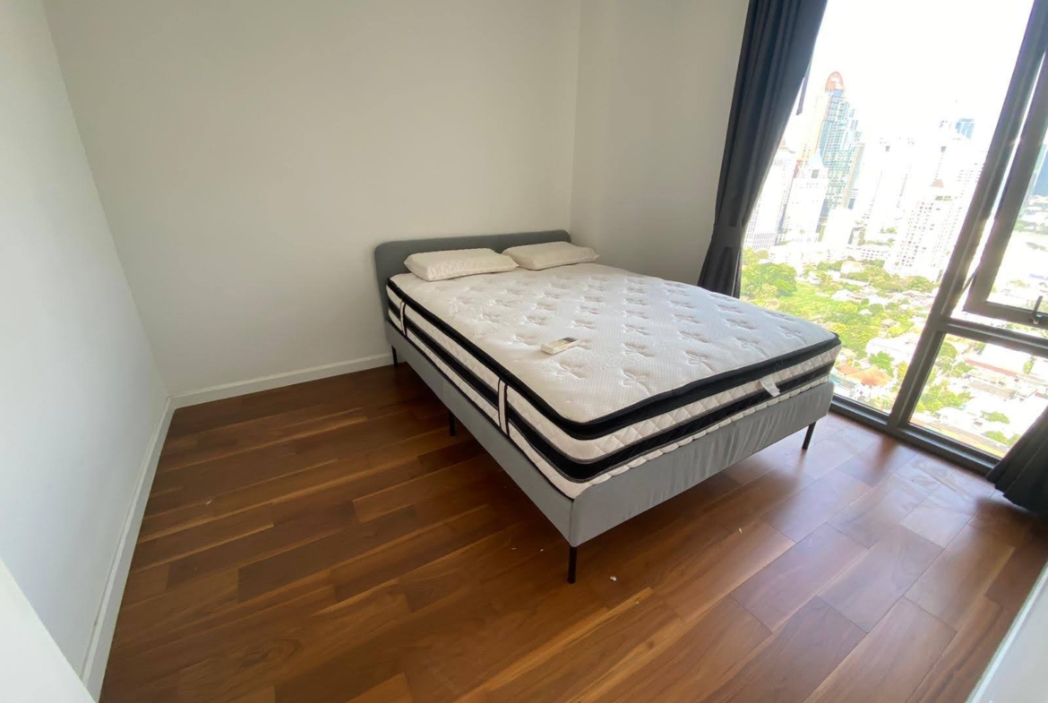 Spacious 2-bed, 2-bath corner unit at Nara 9, 78 sqm, for rent at 50,000 THB/month. Newly renovated with TV & coffee table. Close to Chong Nonsi BTS.