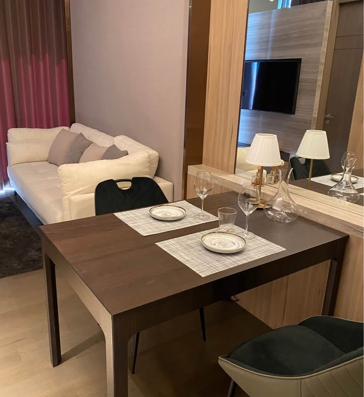 Luxury 1-bedroom apartment at The Esse at Singha Complex, 29th floor, 48 sqm. For rent at 42,000 THB/month or sale at 13.5M THB. Prime Asoke location.