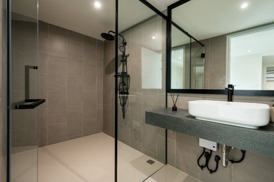 Top-floor corner unit at Le Nice Ekamai featuring a spacious 3-bedroom layout, modern western kitchen with island, and panoramic city views.