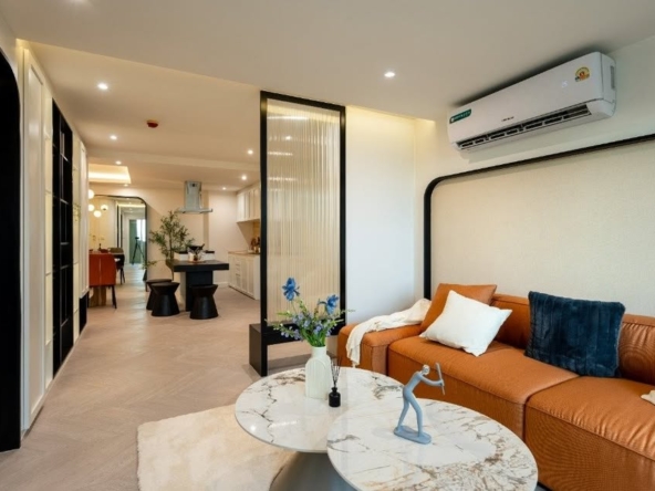 Top-floor corner unit at Le Nice Ekamai featuring a spacious 3-bedroom layout, modern western kitchen with island, and panoramic city views.