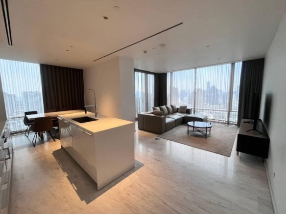 Spacious and modern living room in a 2-bedroom condo at Four Seasons Private Residences, featuring floor-to-ceiling windows and breathtaking views of the Chao Phraya River.