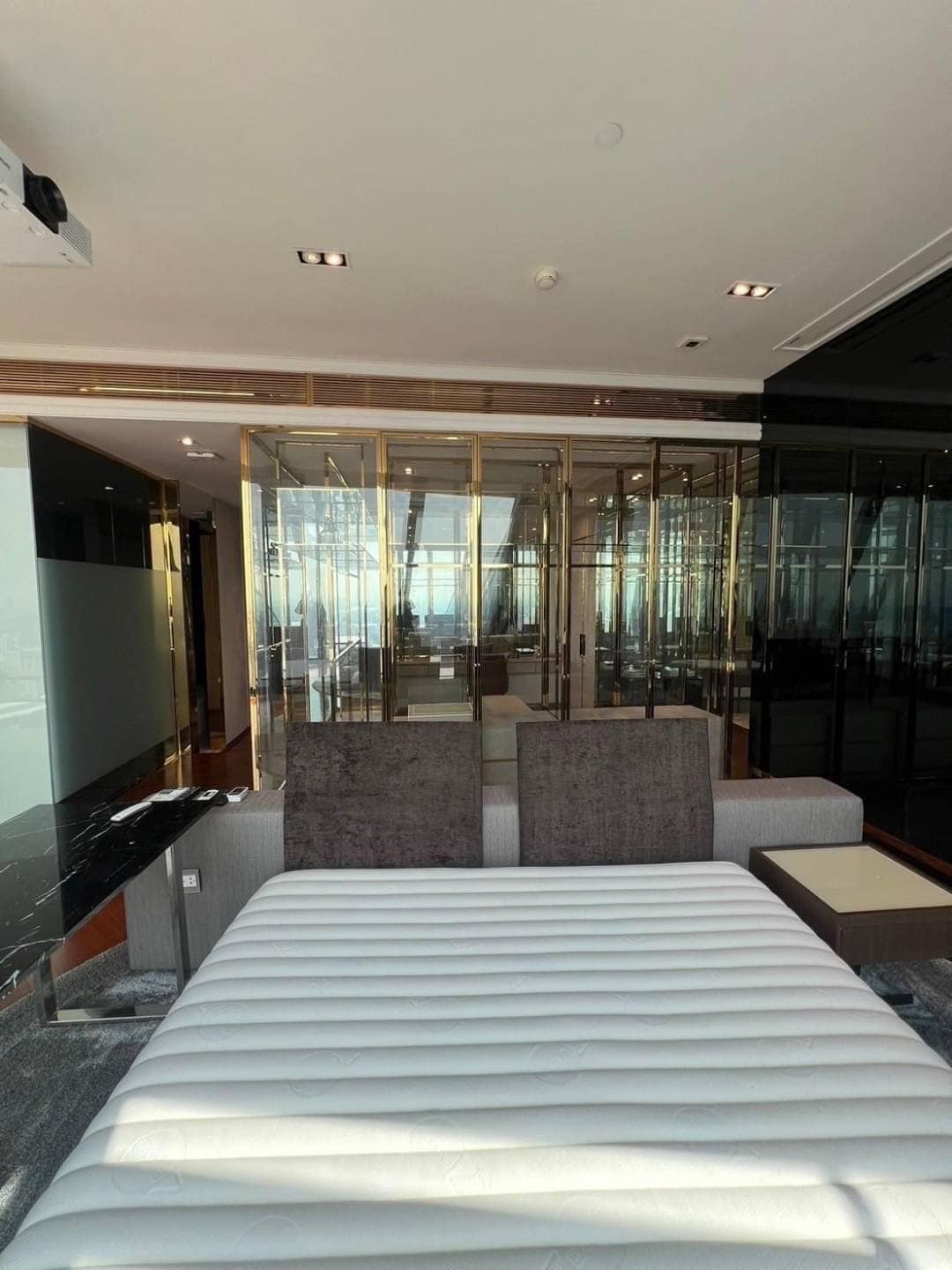 Spacious living room with floor-to-ceiling windows and panoramic city views in a luxury 3-bedroom condo at Marque Sukhumvit 39, Bangkok.