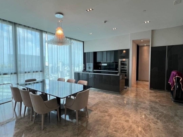 Spacious living room with floor-to-ceiling windows and panoramic city views in a luxury 3-bedroom condo at Marque Sukhumvit 39, Bangkok.