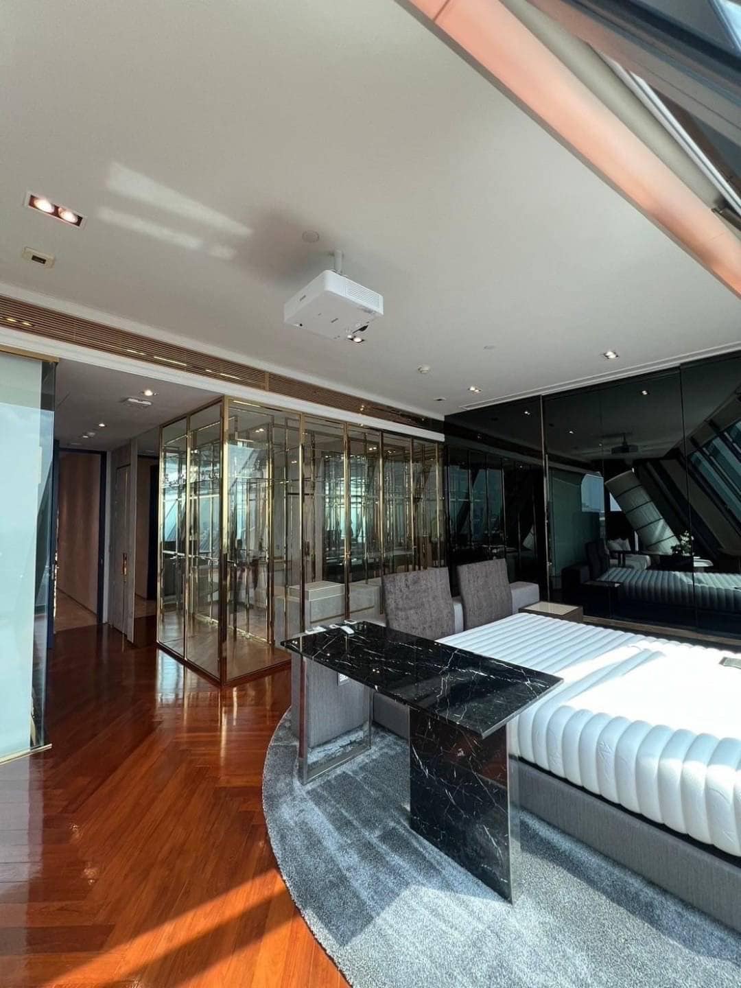 Spacious living room with floor-to-ceiling windows and panoramic city views in a luxury 3-bedroom condo at Marque Sukhumvit 39, Bangkok.