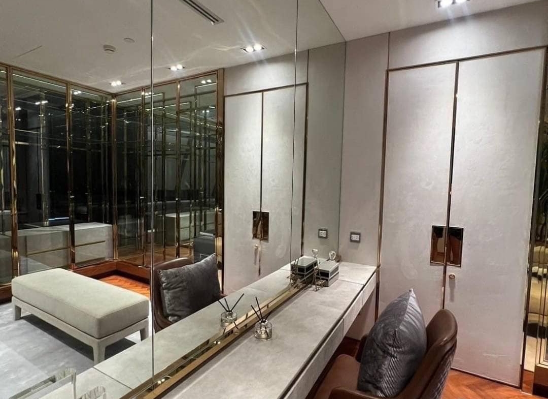 Spacious living room with floor-to-ceiling windows and panoramic city views in a luxury 3-bedroom condo at Marque Sukhumvit 39, Bangkok.