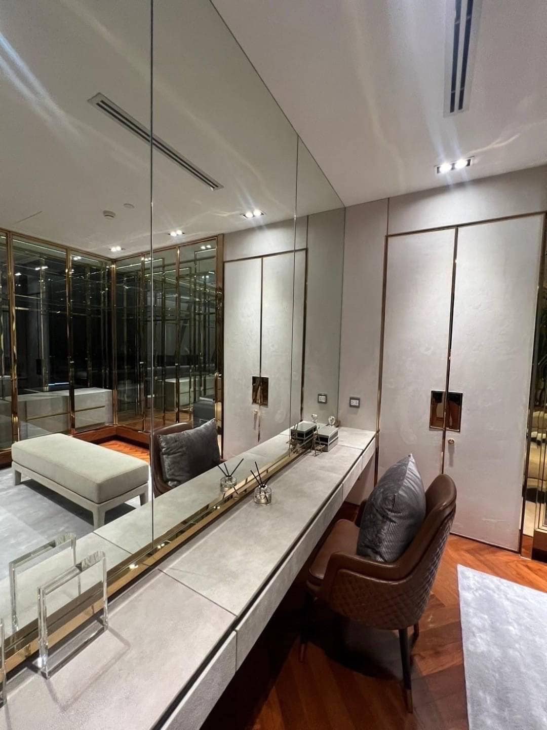 Spacious living room with floor-to-ceiling windows and panoramic city views in a luxury 3-bedroom condo at Marque Sukhumvit 39, Bangkok.