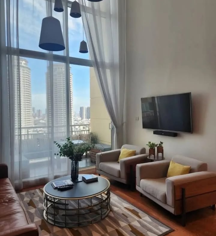 2-bed 2-bath 108 sqm duplex condo in Sathorn for sale at 19.25M THB. Open view, prime location, near BTS, well-maintained building with top amenities.