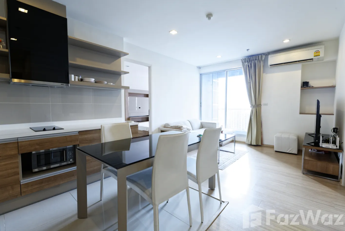"2 Bedrooms, 2 Bathrooms, 63 sqm at Rhythm Sukhumvit 50. Spacious condo for sale at ฿9,900,000. Perfect for city living near On Nut BTS. Contact us today!"