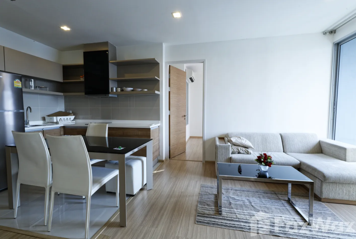 "2 Bedrooms, 2 Bathrooms, 63 sqm at Rhythm Sukhumvit 50. Spacious condo for sale at ฿9,900,000. Perfect for city living near On Nut BTS. Contact us today!"