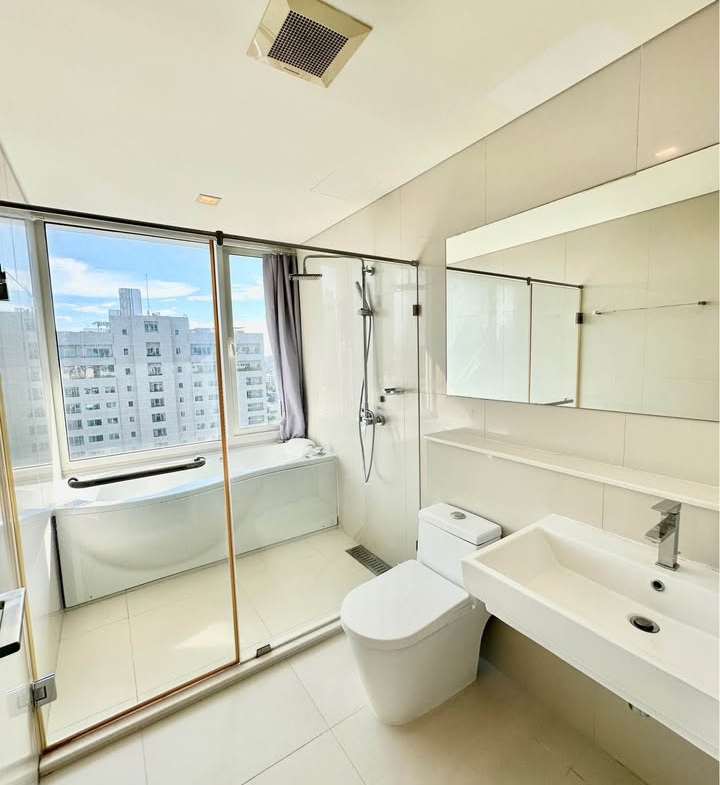 Stylish living room of 2-bedroom condo for rent at IVY Thonglor Bangkok with city view and modern furniture