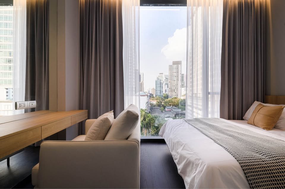 Stylish living room of luxury 2-bedroom condo at LAVIQ Sukhumvit 57 with European furniture and large windows near BTS Thong Lor