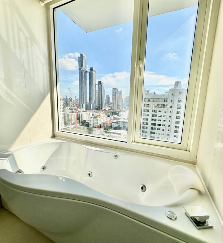 Stylish living room of 2-bedroom condo for rent at IVY Thonglor Bangkok with city view and modern furniture