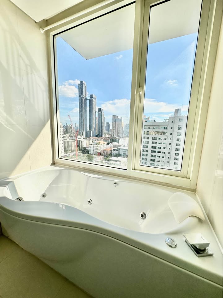 Stylish living room of 2-bedroom condo for rent at IVY Thonglor Bangkok with city view and modern furniture
