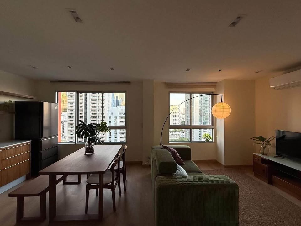 Bright living room of renovated 2-bedroom condo at Condo One X Sukhumvit 26 with city view and modern furnishings