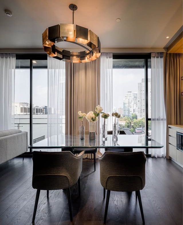 Stylish living room of luxury 2-bedroom condo at LAVIQ Sukhumvit 57 with European furniture and large windows near BTS Thong Lor