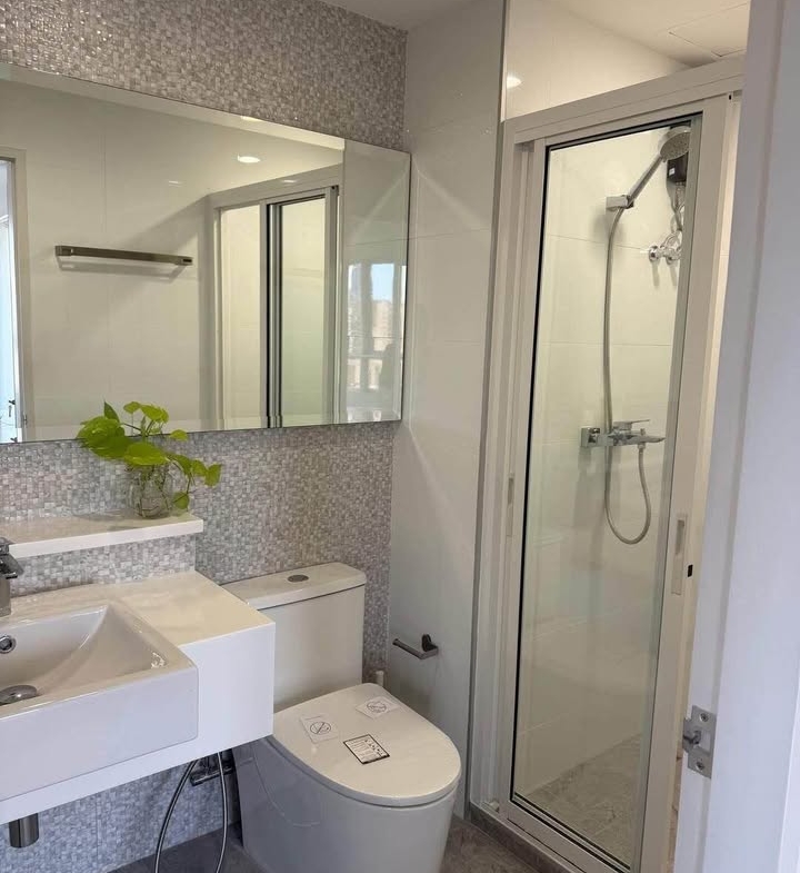 Bright living room of renovated 2-bedroom condo at Condo One X Sukhumvit 26 with city view and modern furnishings