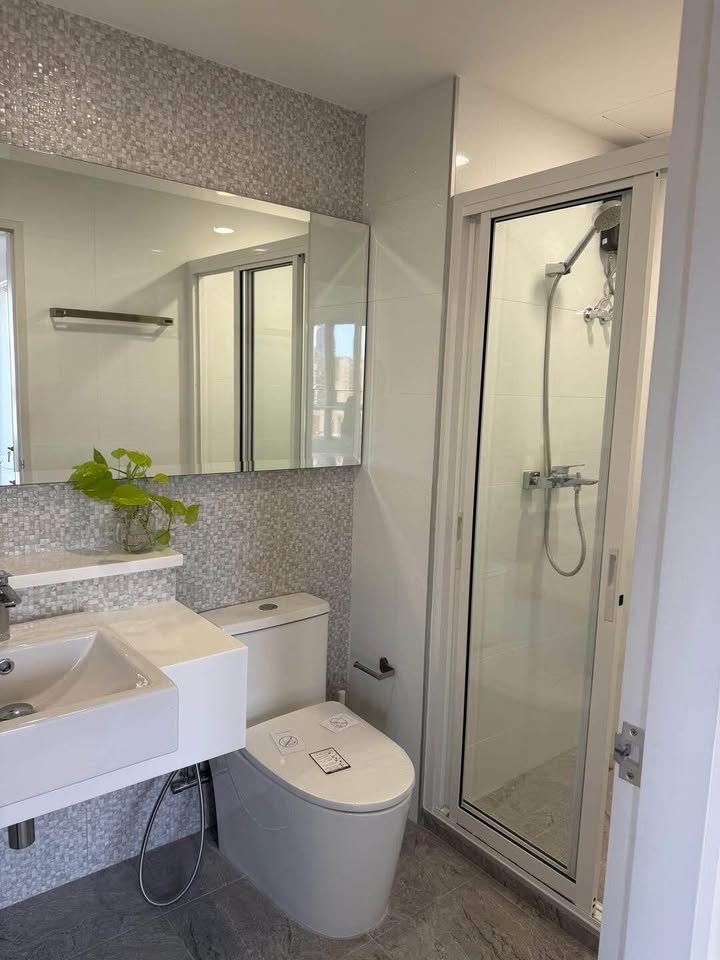 Bright living room of renovated 2-bedroom condo at Condo One X Sukhumvit 26 with city view and modern furnishings