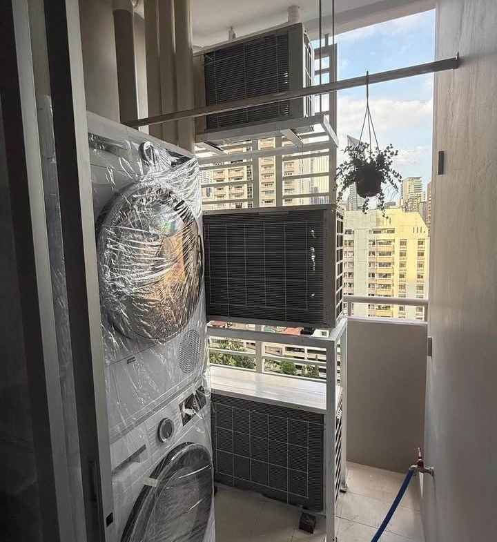 Bright living room of renovated 2-bedroom condo at Condo One X Sukhumvit 26 with city view and modern furnishingsv