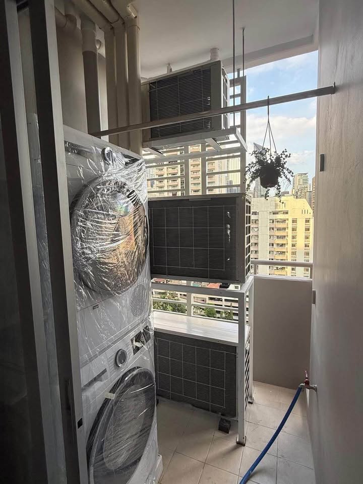 Bright living room of renovated 2-bedroom condo at Condo One X Sukhumvit 26 with city view and modern furnishingsv
