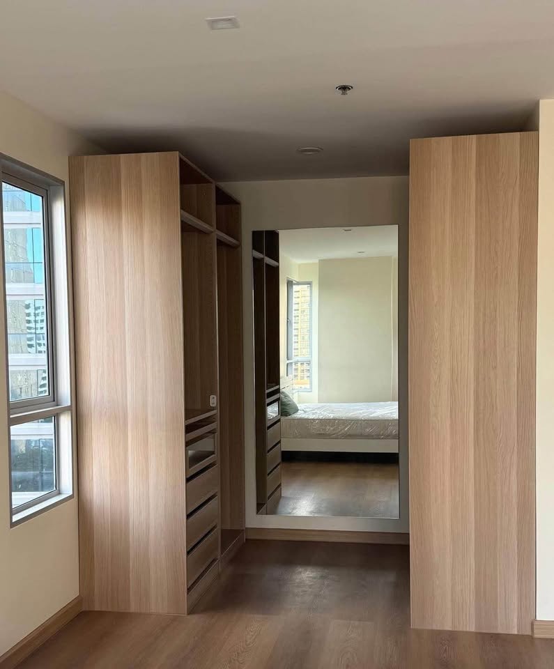 Bright living room of renovated 2-bedroom condo at Condo One X Sukhumvit 26 with city view and modern furnishings