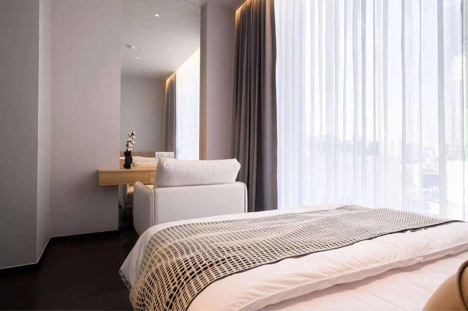 Stylish living room of luxury 2-bedroom condo at LAVIQ Sukhumvit 57 with European furniture and large windows near BTS Thong Lor