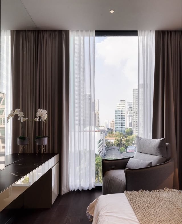 Stylish living room of luxury 2-bedroom condo at LAVIQ Sukhumvit 57 with European furniture and large windows near BTS Thong Lor