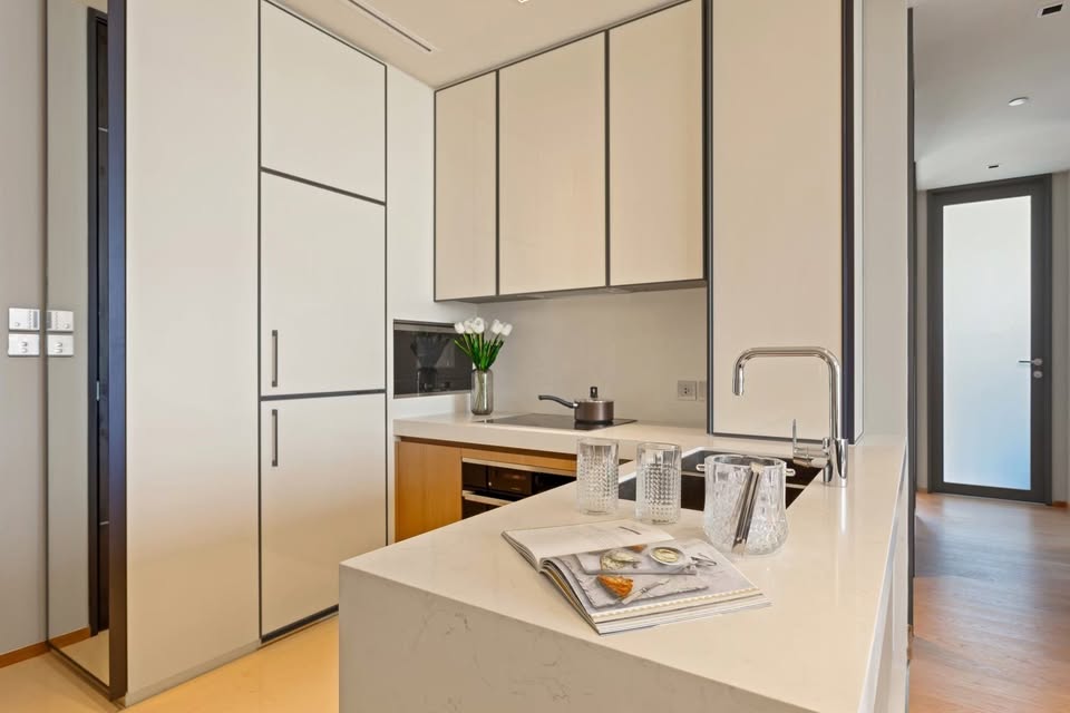 Luxury 2-bedroom condo at BEATNIQ Sukhumvit 32 for sale 21.5M THB. Cheapest unit in the building! High floor, smart home, near BTS. Great investment deal!
