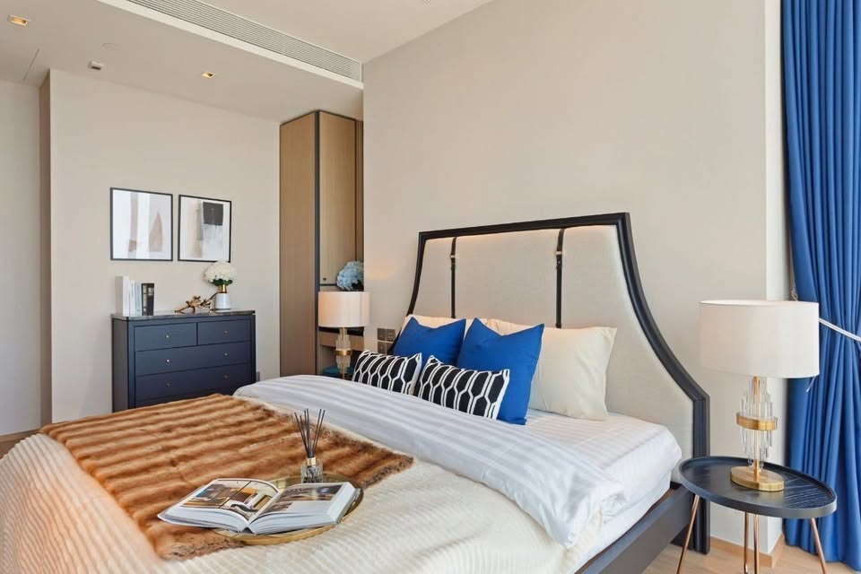 Luxury 2-bedroom condo at BEATNIQ Sukhumvit 32 for sale 21.5M THB. Cheapest unit in the building! High floor, smart home, near BTS. Great investment deal!