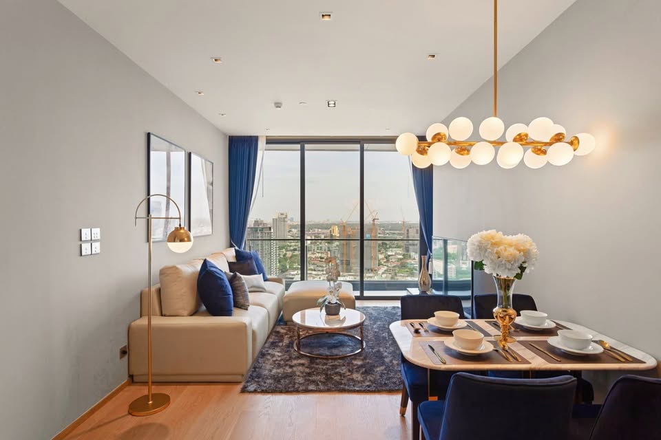 Luxury 2-bedroom condo at BEATNIQ Sukhumvit 32 for sale 21.5M THB. Cheapest unit in the building! High floor, smart home, near BTS. Great investment deal!