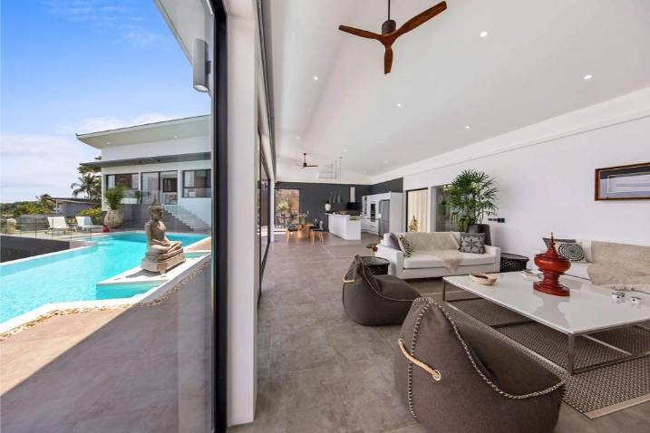 Luxury 4-bed 4.5-bath 882 SQM Villa Coco Koh Samui for sale. Private infinity pool, ocean views, top location in Chaweng Noi. Price 39.75M THB. Contact us now!