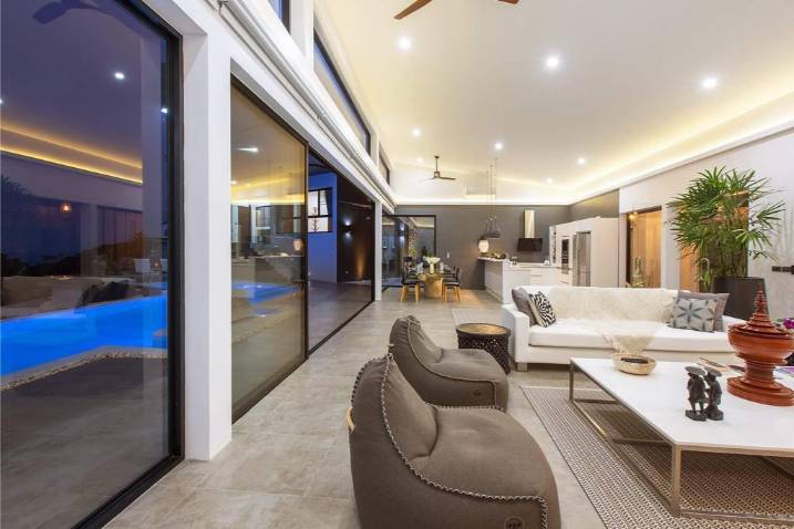 Luxury 4-bed 4.5-bath 882 SQM Villa Coco Koh Samui for sale. Private infinity pool, ocean views, top location in Chaweng Noi. Price 39.75M THB. Contact us now!