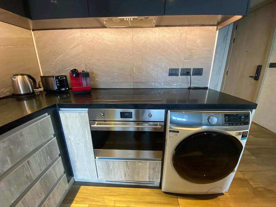 Modern 2BR 1BA condo at The Lofts Asoke, 75 sqm, high floor, fully furnished, prime Sukhumvit location, near MRT and BTS. Minimum 1-year lease.