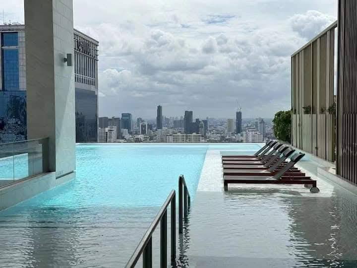 Luxury 1-Bedroom condo at The ESSE Asoke, 44.5 sqm, fully furnished, available for rent at 50K/month. Prime location, close to BTS, MRT, and Terminal 21.