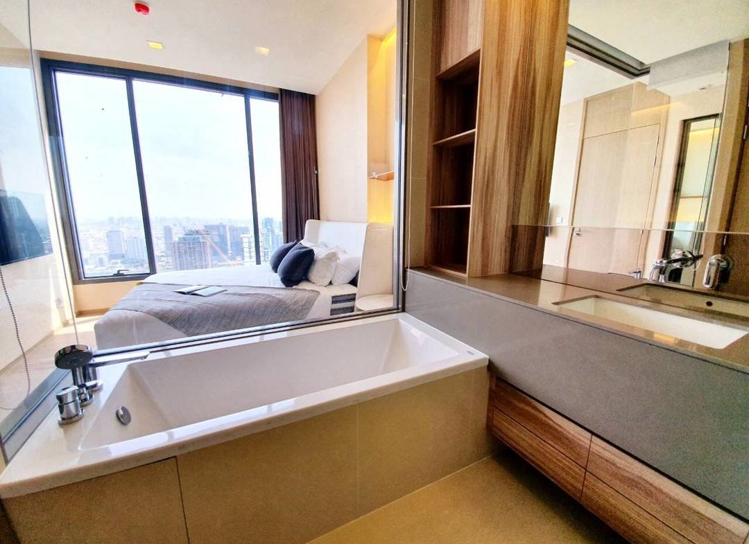 Luxury 1-Bedroom condo at The ESSE Asoke, 44.5 sqm, fully furnished, available for rent at 50K/month. Prime location, close to BTS, MRT, and Terminal 21.