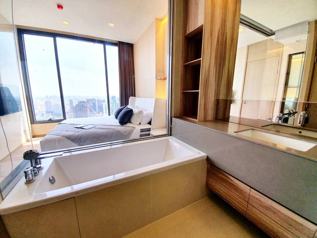 Luxury 1-Bedroom condo at The ESSE Asoke, 44.5 sqm, fully furnished, available for rent at 50K/month. Prime location, close to BTS, MRT, and Terminal 21.